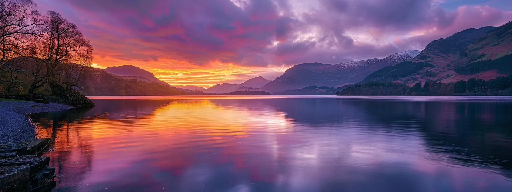 a breathtaking sunset casts vibrant hues of orange and purple over a serene lake, where gentle ripples mirror the fiery sky, creating a tranquil and picturesque landscape.