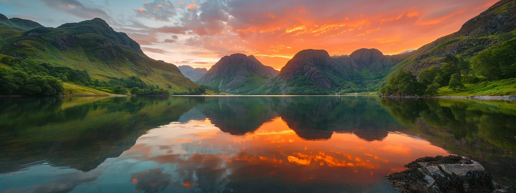 a majestic sunset illuminates a tranquil mountain lake, reflecting vibrant hues of orange and pink across the calm water's surface, framed by lush greenery and towering peaks.