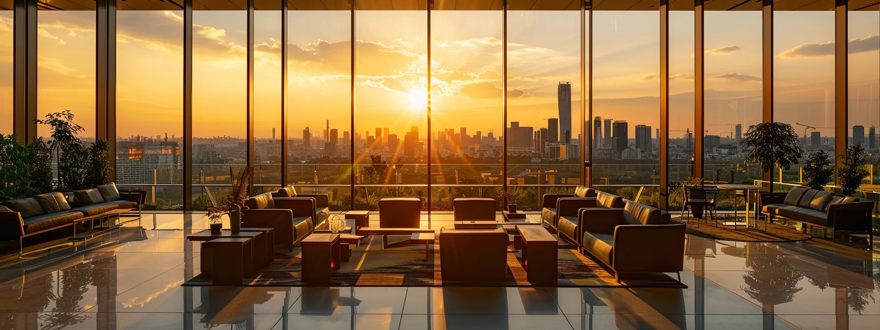 a sleek, modern office space with an expansive glass wall showcases a bustling city skyline, bathed in the warm glow of golden hour, highlighting a vibrant atmosphere of innovation and collaboration.