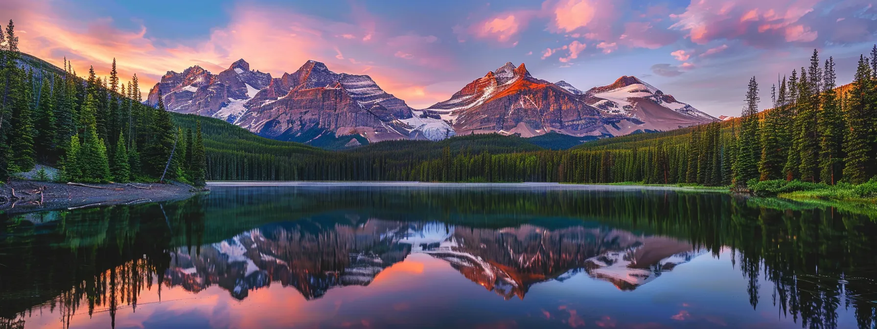 a vibrant sunrise illuminates a serene mountain lake, creating a breathtaking reflection of the surrounding peaks and lush greenery.