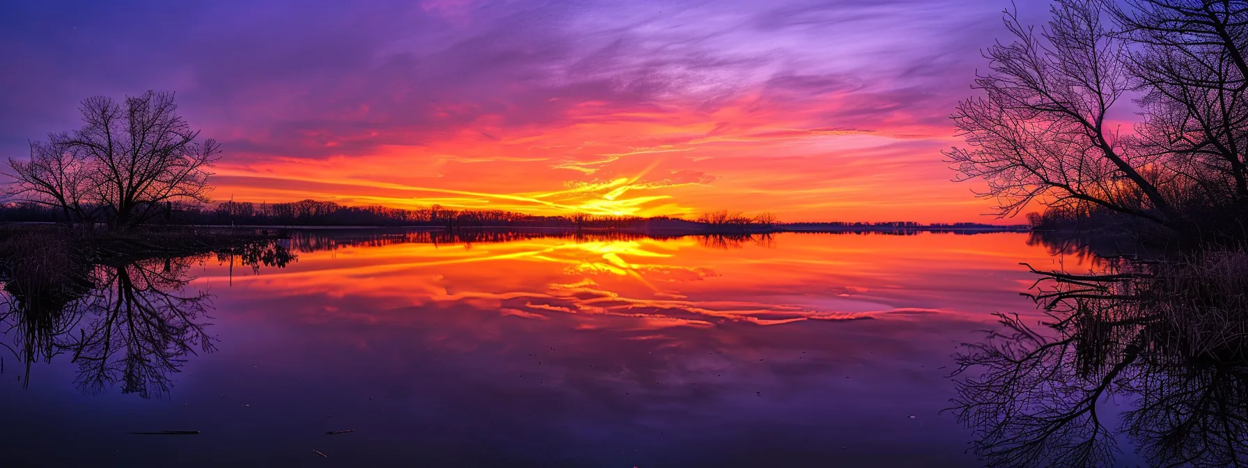 a vibrant sunset casts a warm glow over a tranquil lake, reflecting the fiery oranges and deep purples of the sky, creating a serene atmosphere of peace and beauty.