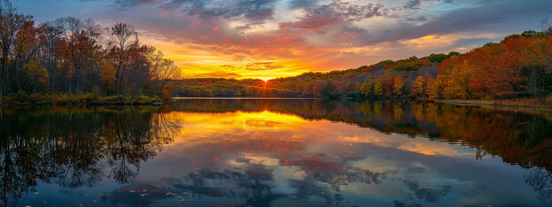 a vibrant sunset casts a warm golden hue over a tranquil lake, where the reflection of colorful autumn trees creates a mesmerizing harmony of nature's beauty.